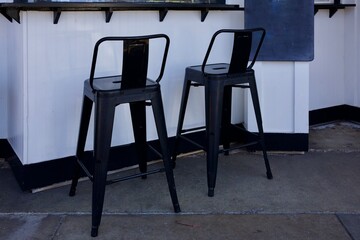 pair of retro black metal bar stools