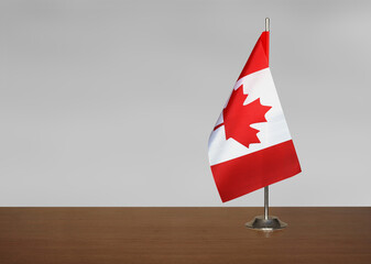 Canada table flag on gray blurred background