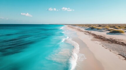 Turquoise Ocean Waves Crashing on a Pristine Sandy Beach