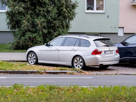 Silver BMW 3-Series estate E91 car parked on street