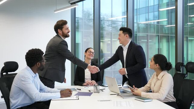 Group businesspeople make agreement Ending team meeting decision and profitable deal, finish planning cooperation shake hands accomplish in conference room. Successful business negotiations handshake