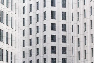 geometrical facade building in snowfall