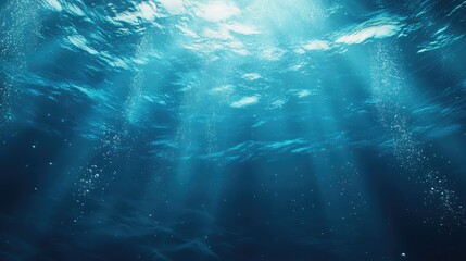 Fototapeta premium Sunlight beams filter through serene underwater depths, creating a tranquil oceanic atmosphere.