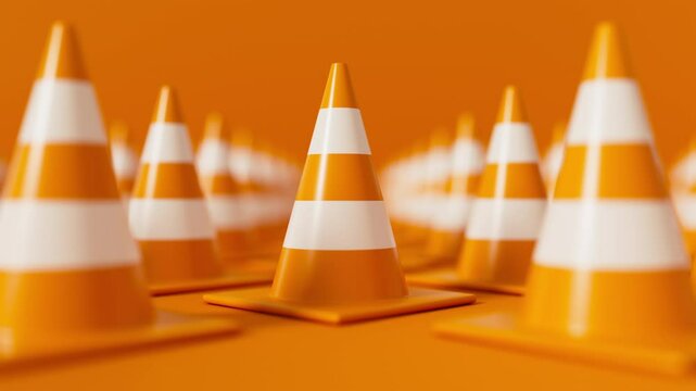 Pan shot of front view on grid of Orange Traffic cones with shallow dof on orange background. Safety warning or under construction symbol. 3d render loop