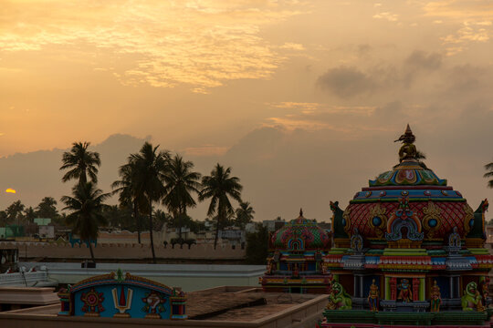 Colorful small gopuram of a temple taken from temple terrace during sunset