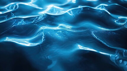 Fototapeta premium Abstract blue water waves create a mesmerizing and tranquil atmosphere.