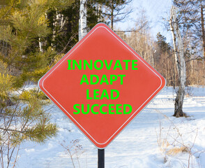 Innovate adapt lead succeed symbol. Concept words Innovate Adapt Lead Succeed on beautiful red road...