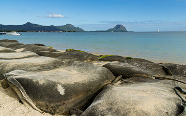 Geotextile bags filled with sand placed along the shoreline for coastal protection against flooding and erosion at La Mivoie beach, Mauritius