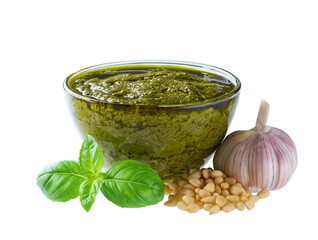 Fresh Italian pesto sauce with basil, pine nuts and and garlic isolated on white background.
