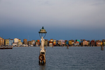 Stella Maris representation, at dusk, against the colorful houses of Sottomarina, Chioggia, Venice...