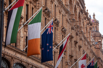 London united kingdom 08 September 2013 flags of different nations on the side of the world famous harrods building