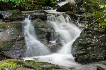 Obraz premium Long exposure of a waterfall at Watersmeet in Exmoor National Park