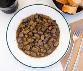 Stew of Habas with blood sausage served on white plate in restaurant