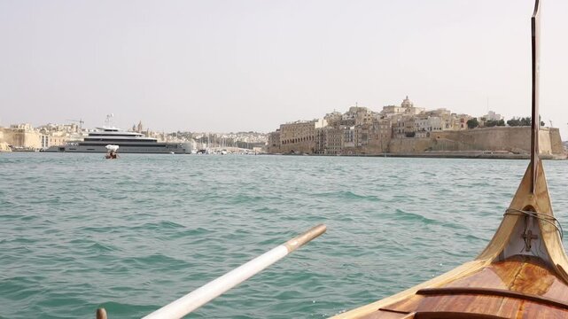 Singlea town view from authentic traditional maltese luzzu boat