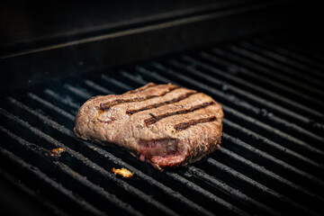 Juicy steak Meat Roasted BBQ Grill. Steak beef Grilled On Hot Barbecue Charcoal Flaming Grill. Grill Dish Closeup View.