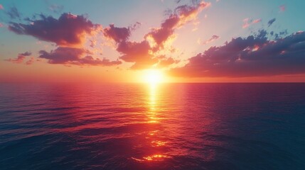 Fototapeta premium Vibrant Sunset Over Calm Ocean Waters Reflecting Golden Hues