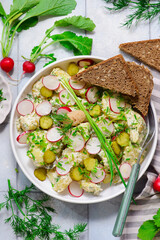 Scandinavian potato salad with gherkins and pollock caviar.