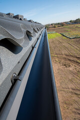 Fototapeta premium Gutter of the drainage system on the house, view from the top
