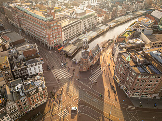 Canals of Amsterdam as seen from above with a drone. Drone photography of European cities. Amsterdam, Netherlands at sunset