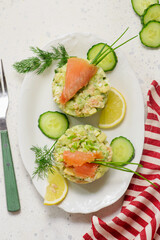 Salad with smoked salmon, avocado and cucumber.
