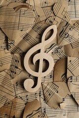 Clef note on paper hearts with notes, top view