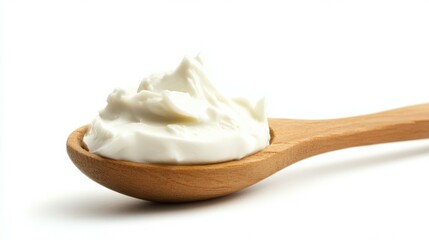 sour cream on wooden spoon, mayonnaise, yogurt, isolated on white background, full depth of field