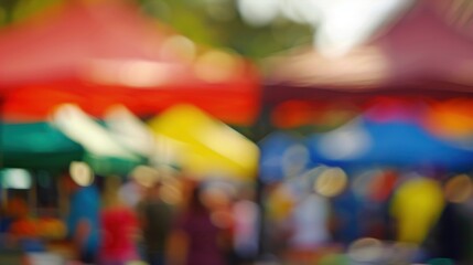A blurred backdrop of colorful tents and bustling activity at an outdoor cooking contest.