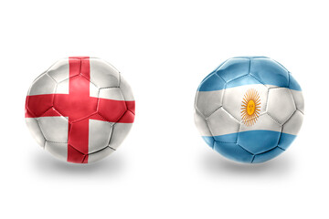 Obraz premium football balls with national flags of england and argentina ,soccer teams. on the white background.