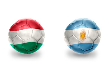 Fototapeta premium football balls with national flags of hungary and argentina ,soccer teams. on the white background.