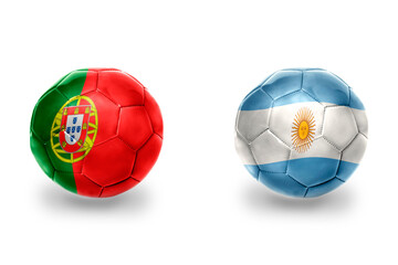 Obraz premium football balls with national flags of portugal and argentina ,soccer teams. on the white background.