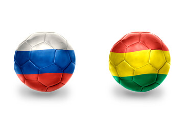 Fototapeta premium football balls with national flags of russia and bolivia ,soccer teams. on the white background.