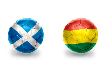 football balls with national flags of scotland and bolivia ,soccer teams. on the white background.