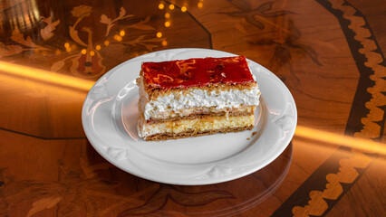 A slice of cake with two thick layers of cream.