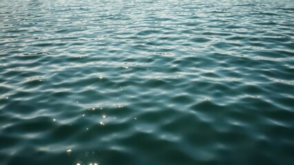 Obraz premium Glistening ripples on the surface of a calm lake, reflection, fresh