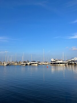 Skive yacht harbor in Skive, Denmark, Europe. Harbor with Wooden Pier and Sailing Ships. Beautiful view. Boats moored in Maarup Havn, Samsoe, Jutland, Denmark. Beauty in nature. Sailboats in harbor