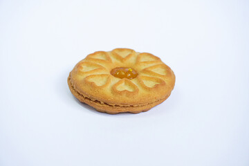 Milk biscuits filled with pineapple jam are isolated on a white background. Biscuits with heart shapes. Valentine's day heart. 