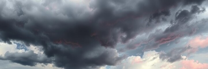 Fototapeta premium Dramatic red sky filled with black ominous clouds, atmospheric, nature