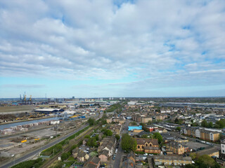 Fototapeta premium High Angle View of Tilbury City Centre and Docks on River Thames, borough of Thurrock, Essex, England, United Kingdom. Aerial View Was Captured with Drone's Camera on April 20th, 2024 at Just After Su