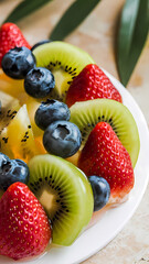 Obraz premium Arrangement of Kiwi, Strawberries, Blueberries, and Pineapple