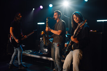 Music band playing live on stage during a concert