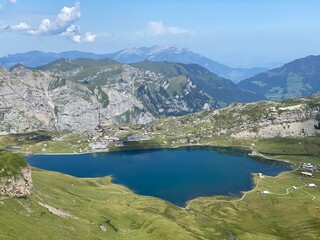Obraz premium The alpine lake Melchsee or Melch Lake in the Uri Alps mountain massif, Kerns - Canton of Obwald, Switzerland (Kanton Obwalden, Schweiz)