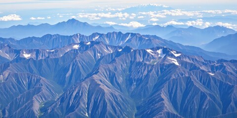 Obraz premium A stunning aerial view of a majestic mountain range, view, high altitude