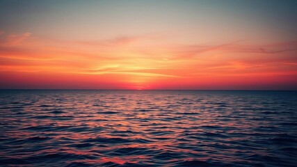 Fototapeta premium Vibrant sunrise over a calm ocean horizon, casting warm hues of orange and pink across the sky, morning, vivid