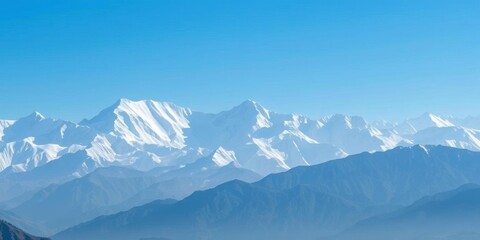 Fototapeta premium Snow-capped peaks of the Nepal mountain range, stretching endlessly into the horizon under a clear blue sky, scenic, Nepal