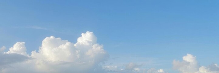 Obraz premium Beautiful blue sky background with fluffy white clouds, creating a peaceful and serene atmosphere, Tranquil, Heaven