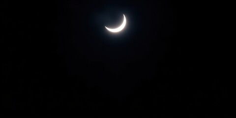 A serene image of a moon crescent shining brightly against a dark night sky, creating a peaceful and enchanting atmosphere, bright, beauty