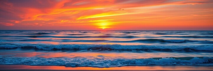 Fototapeta premium A stunning sunrise over a tranquil beach, with colorful sky and gentle waves, nature, horizon