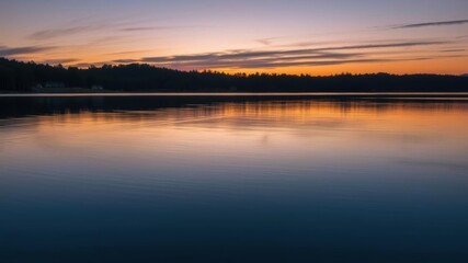 Obraz premium A tranquil image of a serene lake at dusk, with the water reflecting the fading colors of the sky and surrounding landscape, dusk, beauty