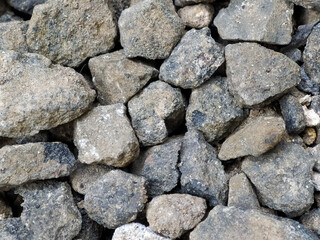 Gray gravel pattern with small pebble road stones, textured background, gravel, pattern. Rough seamless texture, construction material background.