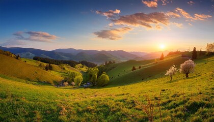 Obraz premium Golden hour panorama of a sun-kissed mountain landscape with rolling hills, lush meadows, and a breathtaking sky
